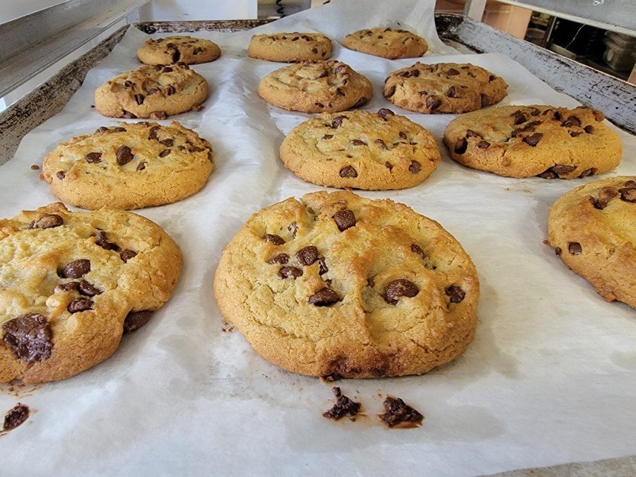 Fresh-baked Zorro's chocolate chip cookies on a bakery sheet