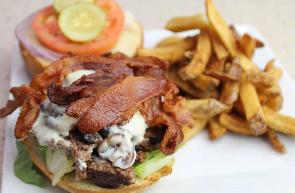 Zorro's fresh smashed burger with bacon on a homemade brioche bun, served with fries